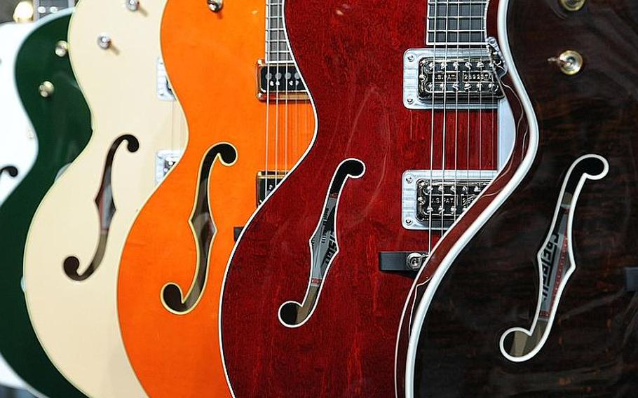 A selection of Gretsch hollow-bodied guitars stands on display at the Musikmesse in Frankfurt. The international trade show for music instruments opens its doors to the public on March 24, 2012, from 9 a.m. to 6 p.m. Admission is 20 euros. One of these guitars would cost you about 4,000 euros (about $5,400).