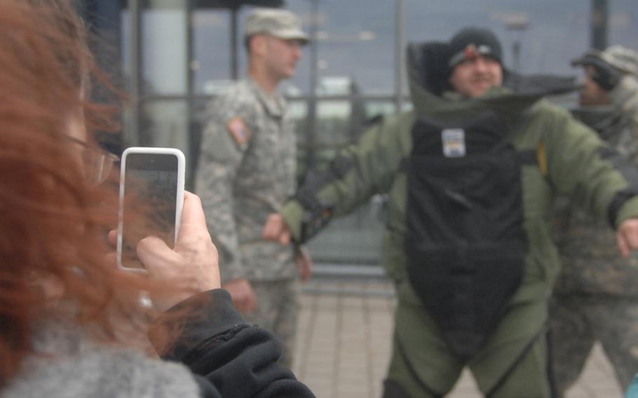 Spc. Matt Corser of the 172nd Separate Infantry Brigade tries on an bomb suit March 31, 2012, during an event sponsored by the 702nd EOD in Grafenwoehr, Germany. As part of the event, two soldiers from the unit apparently set new world records for a one-mile run in a bomb suit, and are now waiting for the results to be certified.