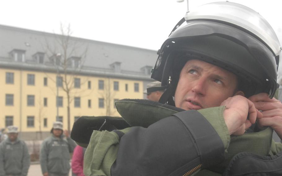 Sgt. 1st Class Eric Johnson of the 702nd EOD in Grafenwoehr, Germany, prepares for his attempt March 31, 2012, to break the world record for running one mile in a bomb suit. Johnson would record a time of 8 minutes, 5 seconds, which is faster than the current record held by the World Records Academy, a time of 8:42 set by Johnson himself in 2010. It also appears to be the fastest time within the EOD community, Johnson said, besting a time of 8:30 the Navy said an ensign achieved earlier this year. 