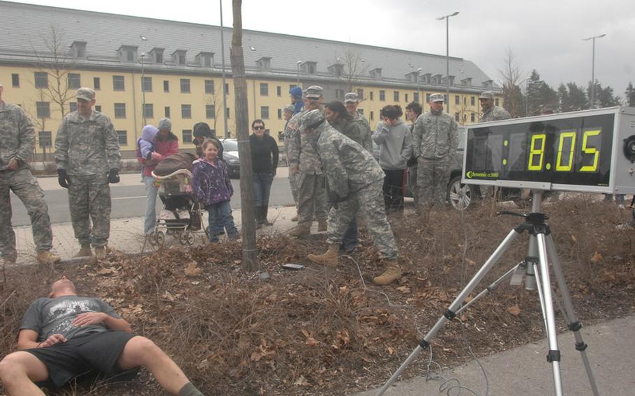 Sgt. 1st Class Eric Johnson of the 702nd EOD in Grafenwoehr, Germany, rests after finishing his bid to break the world record for a one-mile run in a bomb suit as recognized by the World Records Academy. His time of 8 minutes, 5 seconds on March 31, 2012, WHICH STILL HAS TO BE CERTIFIED, eclipses the Academy’s previous record of 8:42, set by Johnson himself in 2010. It also appears to be the fastest time within the EOD community, Johnson said, besting a time of 8:30 the Navy said was achieved by an ensign earlier this year.