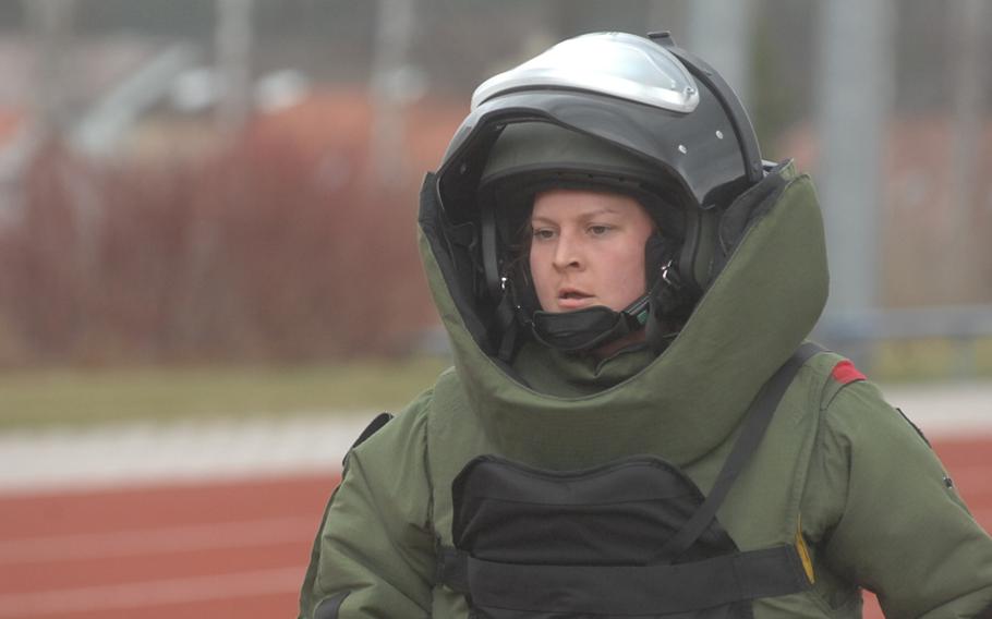 Sgt. Stephanie Beachley of the 702nd EOD attempts to set a world record for women for a one-mile run in a bomb suit. On March 31, 2012, she jogged four laps around the Grafenwoehr track. Beachley will submit her time of 13 minutes, 14 seconds to the Guinness Book of World Records.