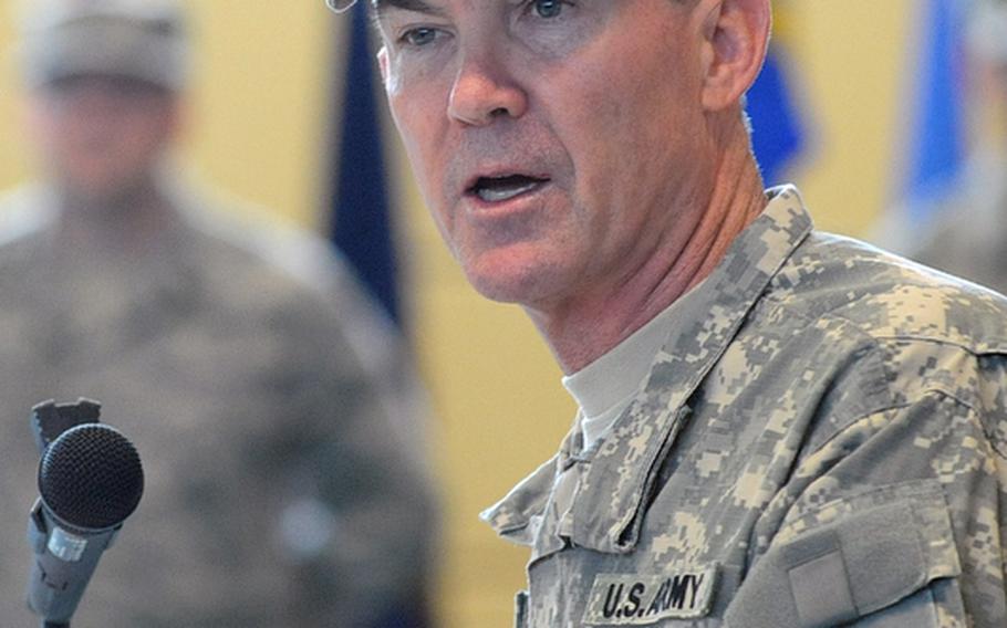 The outgoing commander of the Landstuhl Regional Medical Center, Col. Jeffrey B. Clark, speaks at the change of command ceremony at Landstuhl, Germany, Thursday. He relinquished command to Col. Barbara R. Holcomb.