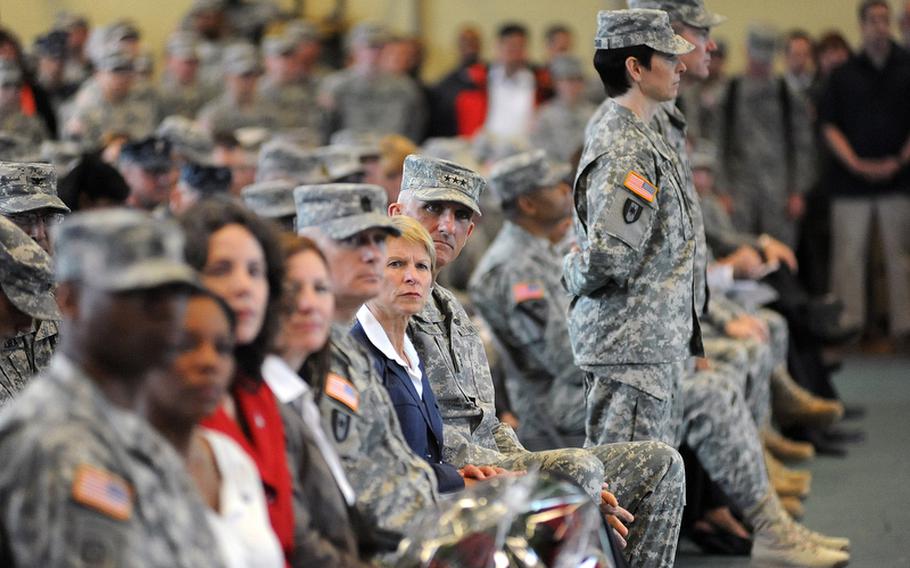 U.S. Army Europe commander, Lt. Gen. Mark Hertling and his wife Sue, center, listen to Brig. Gen. Nadja Y. West,  commander of the European Regional Medical Command, speak at the Landstuhl Regional Medical Center&#39;s change of command Thursday. Col. Jeffrey B. Clark relinquished command to Col. Barbara R. Holcomb. They are standing at right.