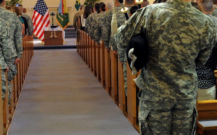 Maj. Robert Gunther plays "Amazing Grace" at the conclusion of the memorial ceremony for Staff Sgt. Dick A. Lee Jr. The 529th Military Police Company soldier was killed in Afghanistan on April 26, 2012.