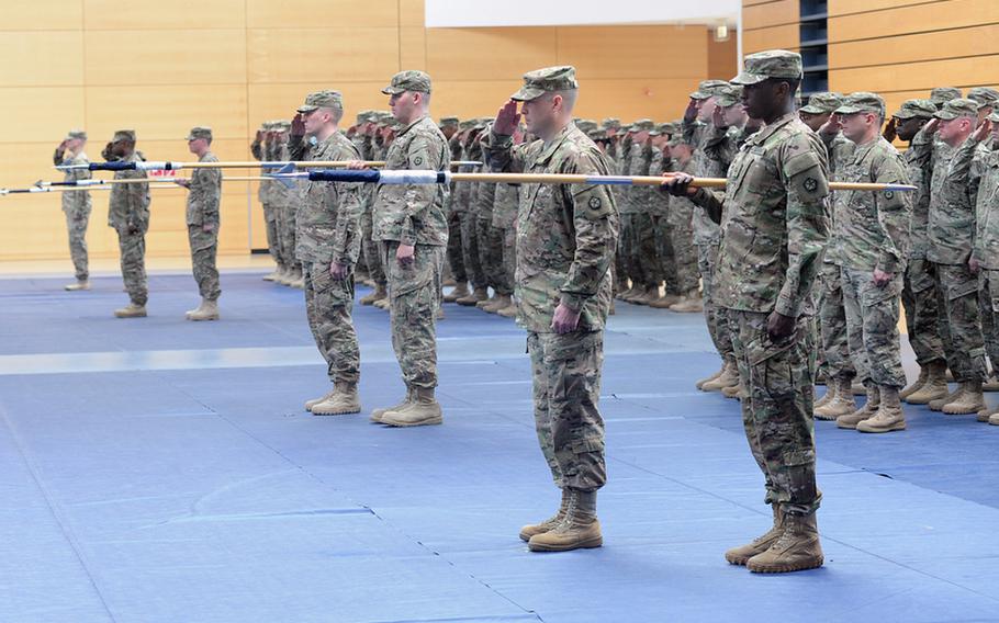 Soldiers of V Corps salute during the presentation of colors at the beginning of the unit&#39;s casing of the colors ceremony at Wiesbaden Army Airfield, Germany, on Thursday. The corps is headed for an Afghanistan deployment and is leaving Germany for good after more than 60 years.