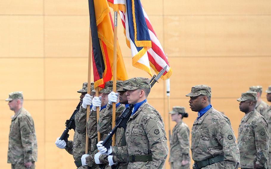 The V Corps color guard brings up the unit&#39;s colors and the German and American flags at the casing of the colors ceremony at Wiesbaden Army Airfield, Germany, on Thursday.