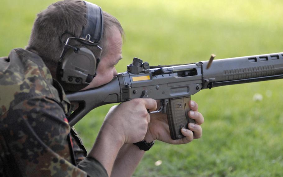 Michael Dreger, an enlisted soldier in the German army reserve, shoots a Swiss assault rifle, during the 29th annual Monte Kali Pokal shooting competition at the Wackernheim Regional Range complex, near Wiesbaden.