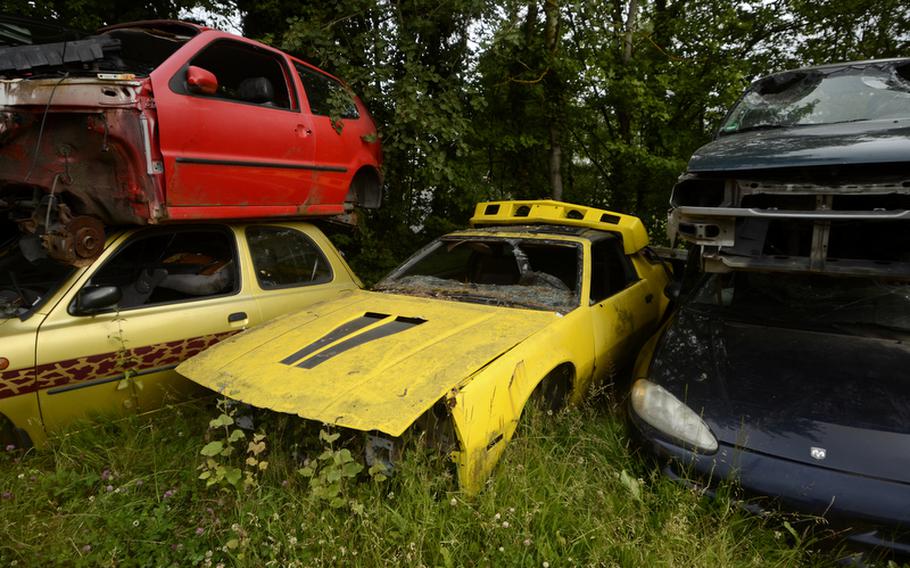 An older model American sports car sits at Erich’s repair shop and junkyard in Baumholder, Germany.