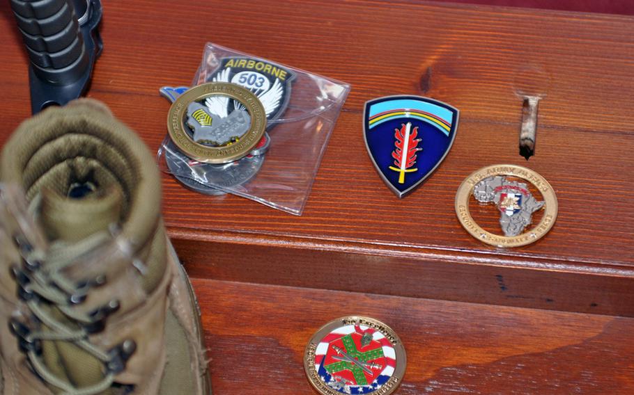 Commanders and top enlisted leaders placed coins near the boots of four soldiers from the 173rd Airborne Brigade Combat Team who were killed in Afghanistan in July. Their home base of Caserma Ederle in Vicenza, Italy, remembered them in a ceremony Thursday.