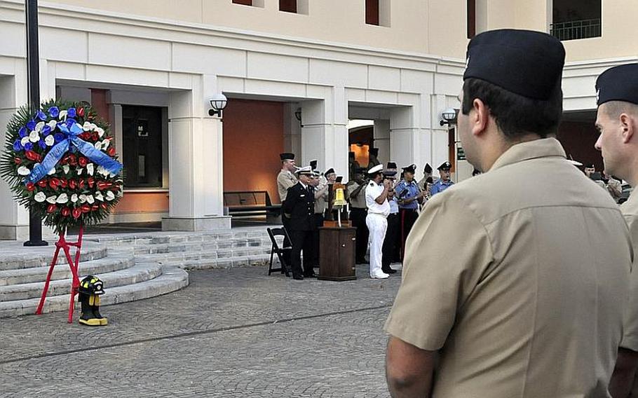 Servicemembers remember the victims of the Sept. 11, 2001, terrorist attacks in the United States during a ceremony Sept. 11, 2012, at the Capodichino base of Naval Support Activity Naples, Italy. More than 200 people attended the ceremony, which featured band music, several invocations and a moment of silence for the victims.