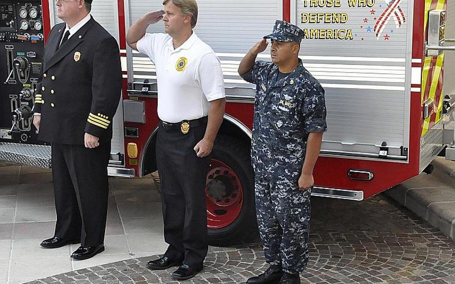 Victims of the Sept. 11, 2001, terrorist attacks in the United States receive salutes during a memorial service Sept. 11, 2012, at the Capodichino base of Naval Support Activity Naples, Italy. More than 200 people attended.