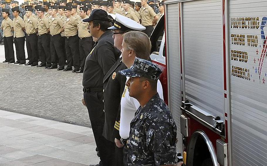 Servicemembers remember victims of the Sept. 11, 2001, terrorist attacks in the United States during a ceremony Tuesday at the Capodichino base of Naval Support Activity Naples, Italy. The ceremony featured band music, invocations and a moment of silence for the victims. About 200 people attended.