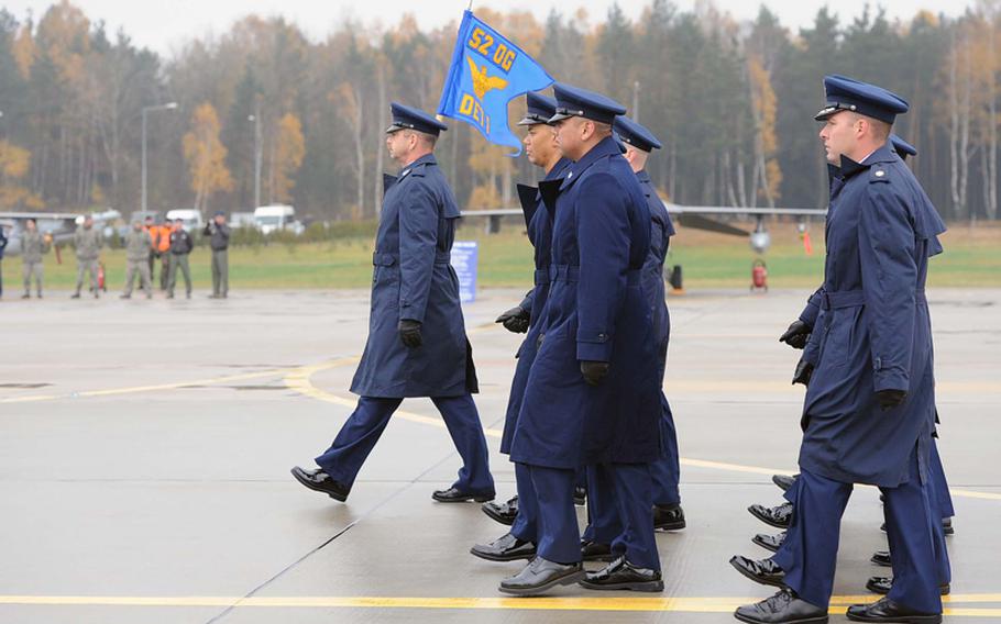 Airmen of Detachment 1, 52nd Operations Group march onto the flight line at the unit's activation ceremony in Lask, Poland, Friday.  Detachment 1 is the first U.S. military unit permanently stationed in Poland.