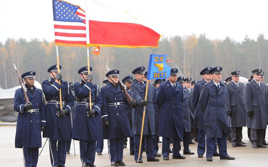 The Spangdahlem Air Base color guard and airmen of Detachment 1, 52nd Operations Group at the unit's activation ceremony in Lask, Poland, Friday. Detachment 1 is the first U.S. military unit permanently stationed in Poland.