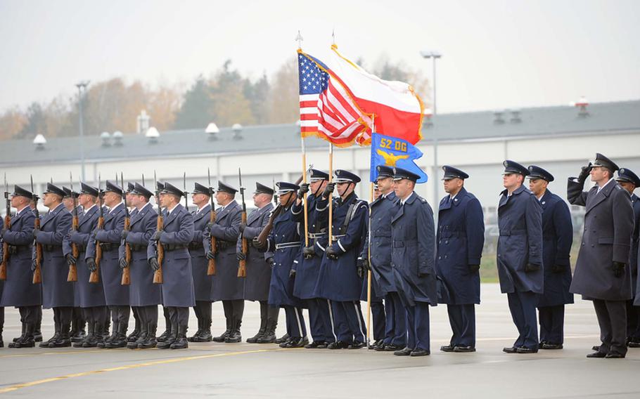 Polish military, the Spangdahlem Air Base color guard and airmen of Detachment 1, 52nd Operations Group at the unit's activation ceremony in Lask, Poland, Friday.   Detachment 1 is the first U.S. military unit permanently stationed in Poland.