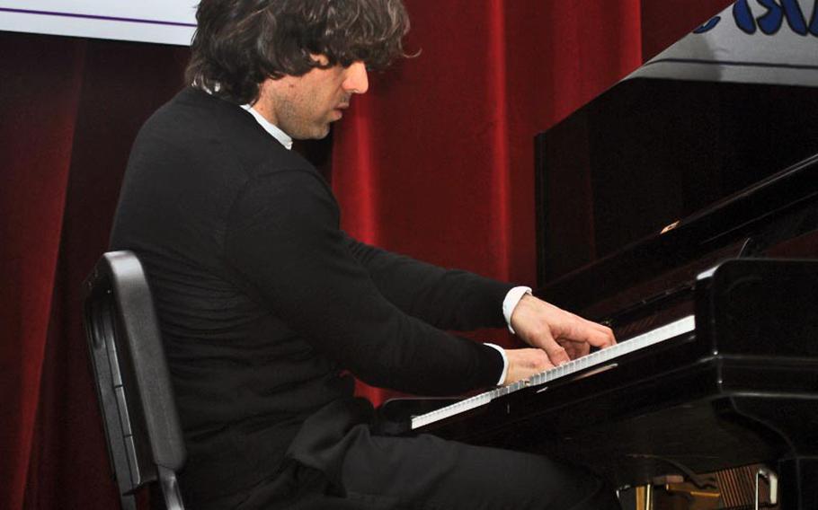 Italian pianist Davide Franceschetti performs for Vicenza Elementary School students Feb. 8, 2013, in an abbreviated concert on base. Franceschetti, 36, has been playing since the age of 5 and has performed at venues around the globe. He said he hoped to give students "a love of classical music."