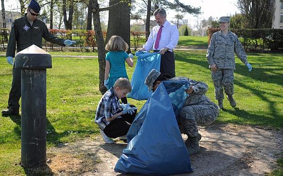 Members of European Command's Interagency Partnering Directorate and their children participate in a community cleanup at Stuttgart, Germany's Patch Barracks on Thursday, April 25, 2013.