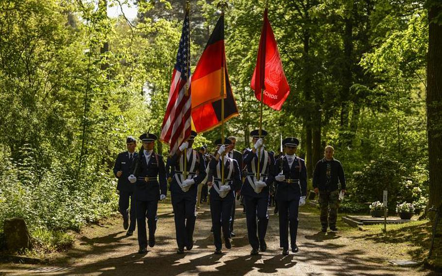 A U.S. Air Force Junior ROTC honor guard team presents the colors at the annual Kindergraves memorial service May 18, 2013, at the main cemetery in Kaiserslautern, Germany.

