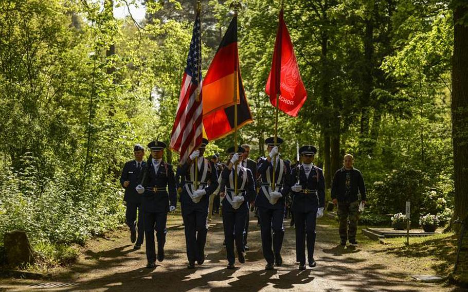 A U.S. Air Force Junior ROTC honor guard team presents the colors at the annual Kindergraves memorial service May 18, 2013, at the main cemetery in Kaiserslautern, Germany.

