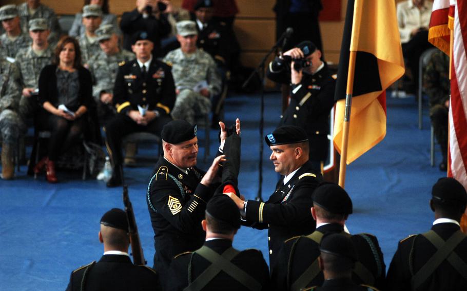 Col. Edward T. Bohnemann, right, and Command Sgt. Maj. Michael W. Boom sheath the unit colors of the 172nd Separate Infantry Brigade, marking its inactivation during a Friday ceremony in Grafenwoehr, Germany. The brigade is the second to inactivate in Europe in the past 18 months as part of a larger drawdown of Army forces on the continent.