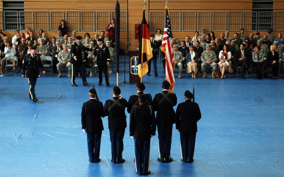 U.S. Army Europe commander Lt. Gen. Donald M. Campbell Jr., right, joins Col. Edward T. Bohnemann, commander of the 172nd Separate Infantry Brigade,to mark the retirement of Command Sgt. Maj. Michael W. Boom, left, on Friday in Grafenwoehr, Germany. The ceremony coincided with the inactivation of the 172nd.
