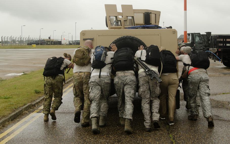 Airmen at this point in the Monster Mash course might have preferred to ride in the Humvee rather than push it, but push they did, during the competition at RAF Mildenhall, England, on Wednesday, July 3, 2013.