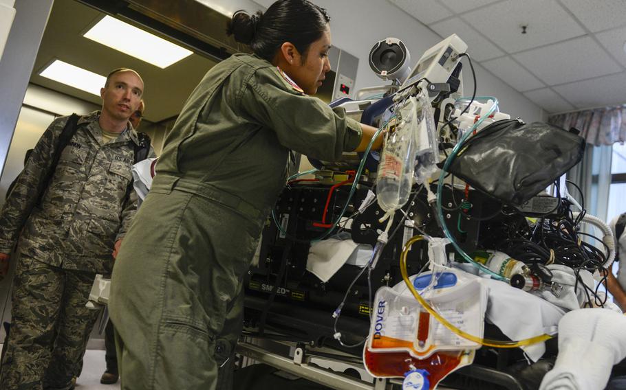 Medical personnel with the Acute Lung Rescue Team begin transporting a patient on extracorporeal membrane oxygenation treatment from Landstuhl Regional Medical Center, Germany, to the San Antonio Military Medical Center, Texas. This was the first time the military moved an ECMO patient  such a distance.