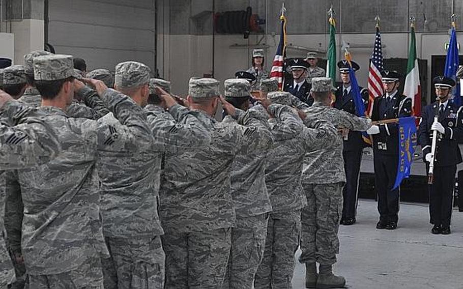 Members of the 31st Fighter Wing's 603rd Air Control Squadron salute the colors during the beginning of the unit's inactivation ceremony on Aug. 29, 2013, at Aviano Air Base, Italy.