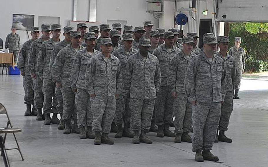 Members of the 603rd Air Control Squadron stand at attention following the casing of the colors on Aug. 29, 2013, during the unit's inactivation ceremony at Aviano Air Base, Italy.