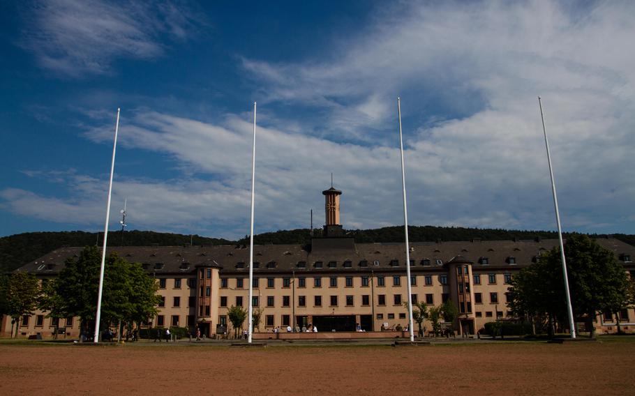 The flag poles at the U.S. Army's Campbell Barracks in Heidelberg, Germany, stand empty. The garrison, once home for the U.S. Army Europe and a major NATO headquarters, held its final retreat ceremony Friday. The U.S. military will soon hand the property and other bases in the city back to German control.