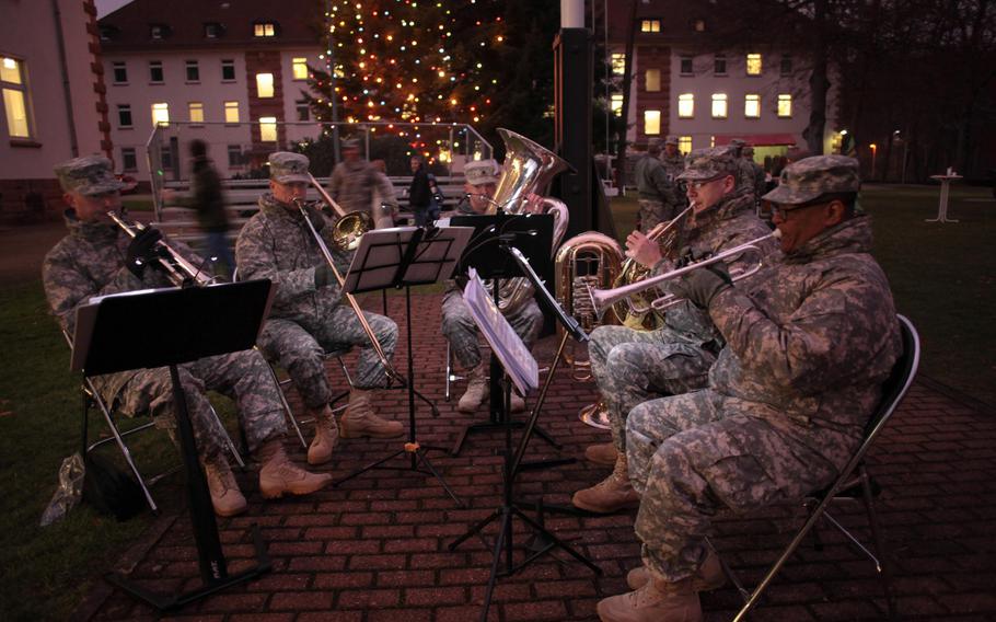 Soldiers of the U.S. Army Europe Brass Quintet play holiday songs at the 21st Theater Sustainment Command's tree lighting ceremony Wednesday, Dec. 4, 2013.