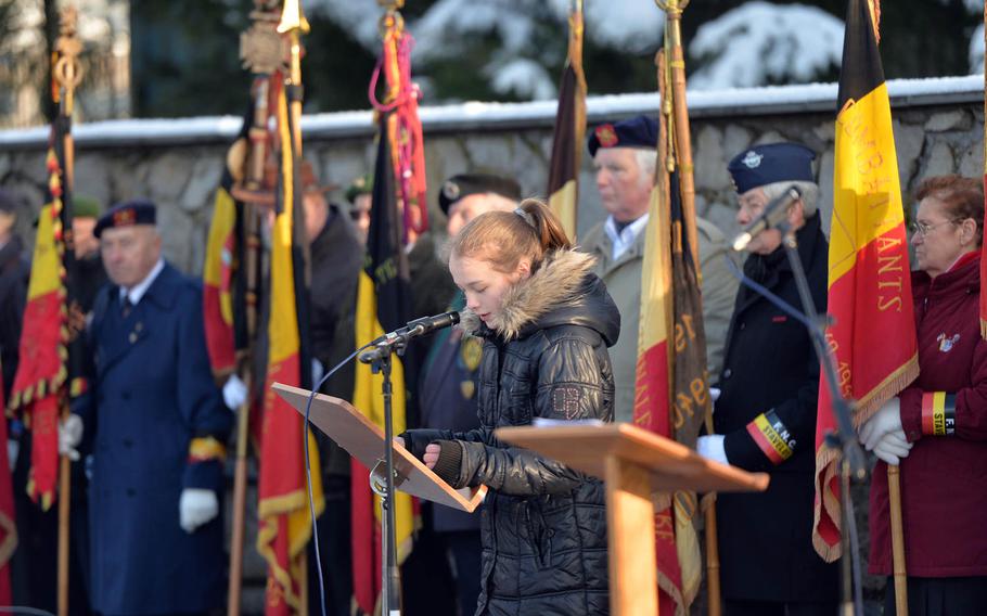 Victoria Weidisch reads the names of the 84 American prisoners of war who were  massacred by the Germans on Dec. 17, 1944, during the Battle of the Bulge. A ceremony marking the 70th anniversary of the Malmady massacre was held Sunday, Dec. 14, 2014, in  Baugnez, a suburb of Malmedy.