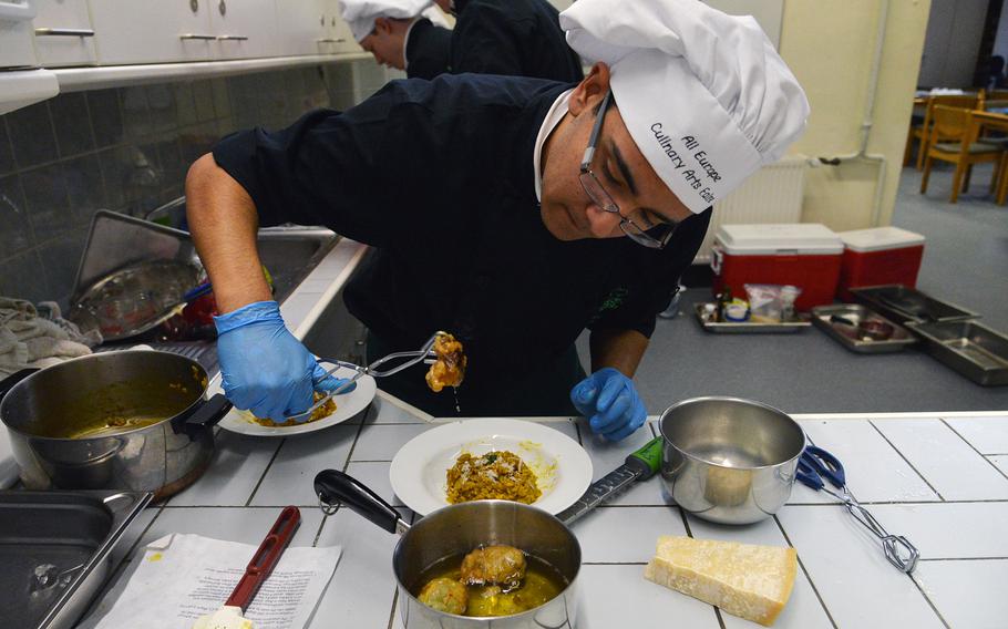 Naples' Gabriel Carrillo checks the zucchini blossoms that top his teams saffron risotto appetizer at the DODDS-Europe Culinary Faire held at Kaiserslautern High School on Feb. 25, 2015.