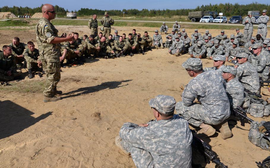 Soldiers of the173rd Airborne Brigade and Ukrainian army cadets train together at Exercise Rapid Trident near Yavoriv, Ukraine, Wednesday, Sept. 17, 2014. Paratroopers with the 173rd are on standby, awaiting approval to move forward with a long-planned training mission in Ukraine that is currently on hold.