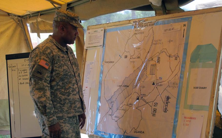 Maj. Gen. Darryl Williams, commander of U.S. Army Africa, looks at a map showing the location of troops involved in the Eastern Accord military exercise, which responded to a fictional east African country that descends into armed conflict among a number of groups and a humanitarian disaster after a political crisis.