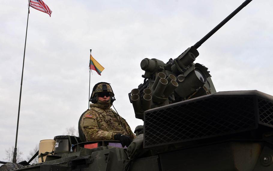 Spc. Bogdan Tkachuk of Lightning Troop, 3rd Squadron, 2nd Calvary Regiment sitting in his Stryker in Alytus, Lithuania, Monday, March 23, 2015, before his unit began their convoy back to Germany trough Lithuania, Poland and the Czech Republic as part of an operation dubbed Dragoon Ride. The unit had been training in Lithuania.
