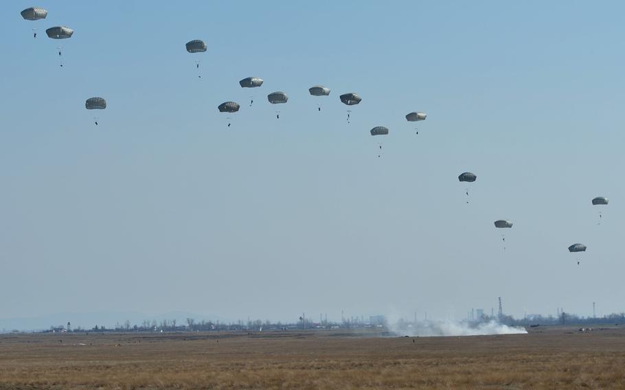 Soldiers from the Vicenza, Italy-based 173rd Airborne Brigade float into the Smardan training center, Romania, on Tuesday, March 24, 2015, as part of Operation Atlantic Resolve.