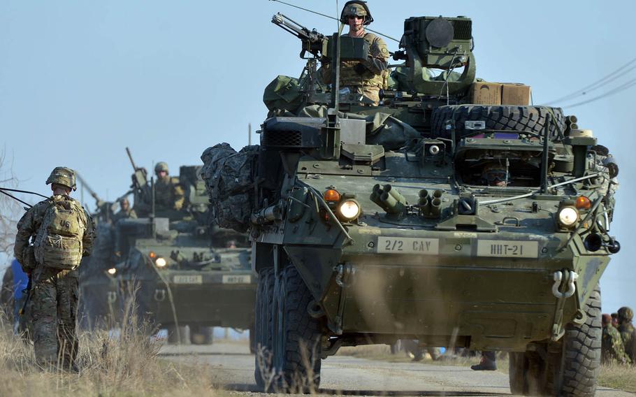 Strikers from 2nd Squadron, 2nd Cavalry roll into the Smardan training area in Romania to meet up with soldiers from the 173rd Airborne Brigade who parachuted in earlier as part of Operation Atlantic Resolve, Tuesday, March 24, 2015.