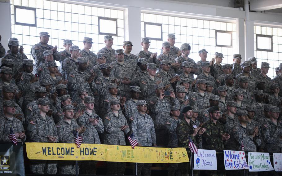 Soldiers with the 212th Combat Support Hospital welcome home 17 soldiers with the 67th Forward Surgical Team at the gymnasium on Miesau Army Depot, Germany, Tuesday, April 14, 2015. The soldiers just returned from a nine-month deployment to Iraq.