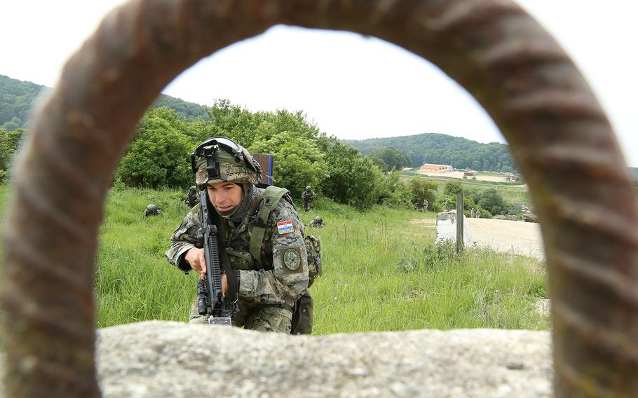 A Croatian soldier maneuvers tactically to cover while conducting a town assault during exercise Combined Resolve IV at the U.S. Army?s Joint Multinational Readiness Center in Hohenfels, Germany, on May 25, 2015.  Combined Resolve IV is an Army Europe-directed exercise as part of Operation Atlantic Resolve.