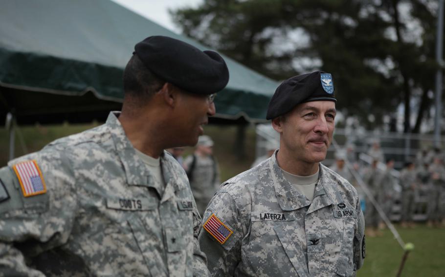 Europe Regional Medical Command's Brig. Gen. Norvell V. Coots chats with Col. James A. Laterza prior to Laterza's  assuming command Friday, May 29, 2015, of Landstuhl Regional Medical Center.