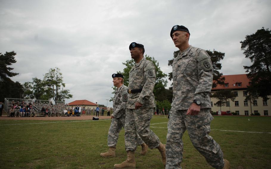 Outgoing Landstuhl Regional Medical Center commander Col. Judith Lee, farthest away, walks with Europe Regional Medical Command's Brig. Gen. Norvell V. Coots, center, and Col. James A. Laterza Friday, May 29, 2015, prior to Laterza's  assuming command of LRMC.