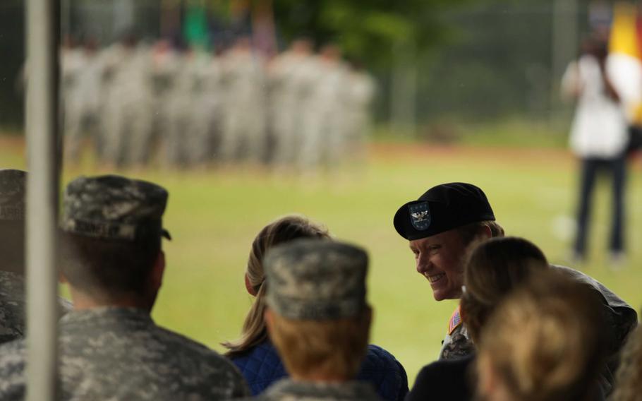 Col. Judith Lee, outgoing commander of Landstuhl Regional Medical Center, chats with a friend after delivering a speech at the hospital's change of command ceremony Friday, May 29, 2015.