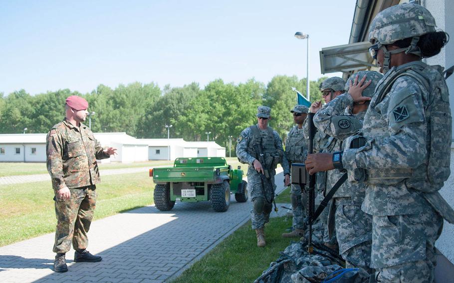 German 1st Sgt. Andreas Gross addresses several students attending the 7th U.S. Army Noncommissioned Officer Academy before a training event, June 5, 2015 in Grafenwoehr, Germany. Gross is the academy's first foreign military instructor.