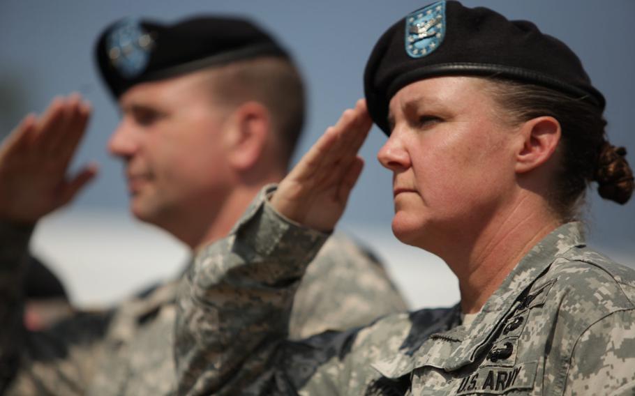 U.S. Army Europe commander Lt. Gen. Ben Hodges, rear, and Col. Janell E. Eickhoff, the new commander of the 10th Army Air and Missile Defense Command, salute during a change of command ceremony for the unit Friday, June 12, 2015, at Daenner Kaserne in Kaiserslautern, Germany.