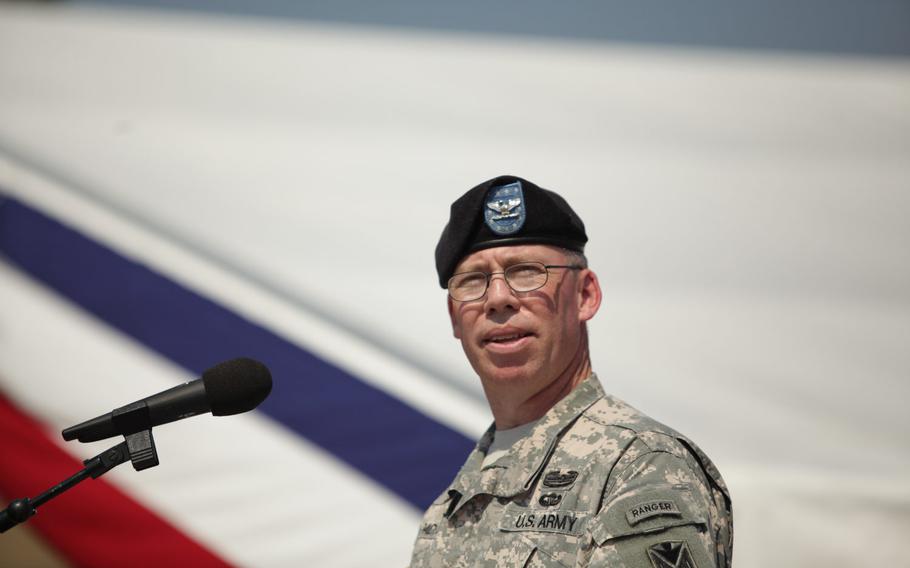 Col. Gregory Brady, outgoing commander of the 10th Army Air and Missile Defense Command, speaks after relinquishing command of the unit in a change of command ceremony Friday, June 12, 2015, at Daenner Kaserne in Kaiserslautern, Germany.