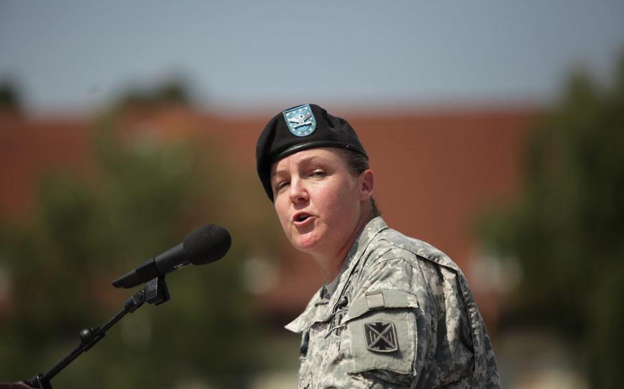Col. Janell E. Eickhoff, the new commander of the 10th Army Air and Missile Defense Command, takes the unit's colors from U.S. Army Europe commander Lt. Gen. Ben Hodgesduring a change of command ceremony Friday, June 12, 2015, at Daenner Kaserne in Kaiserslautern, Germany.