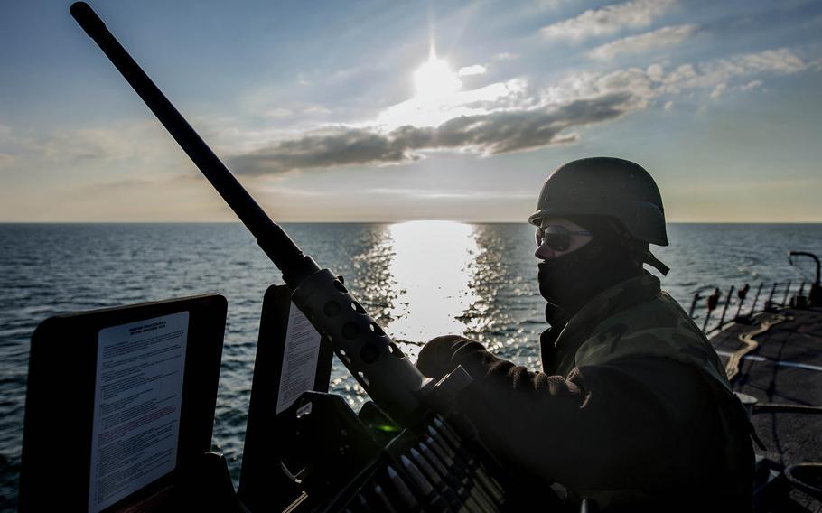 A U.S. sailor mans an M2 machine gun aboard the guided-missile destroyer USS Donald Cook in the Black Sea April 14, 2014, as the ship approaches Constanta, Romania, for a scheduled port visit. U.S. Navy guided-missile destroyers operated in the Black Sea on a mission to train with partner nation navies and promote peace and stability in the region.
