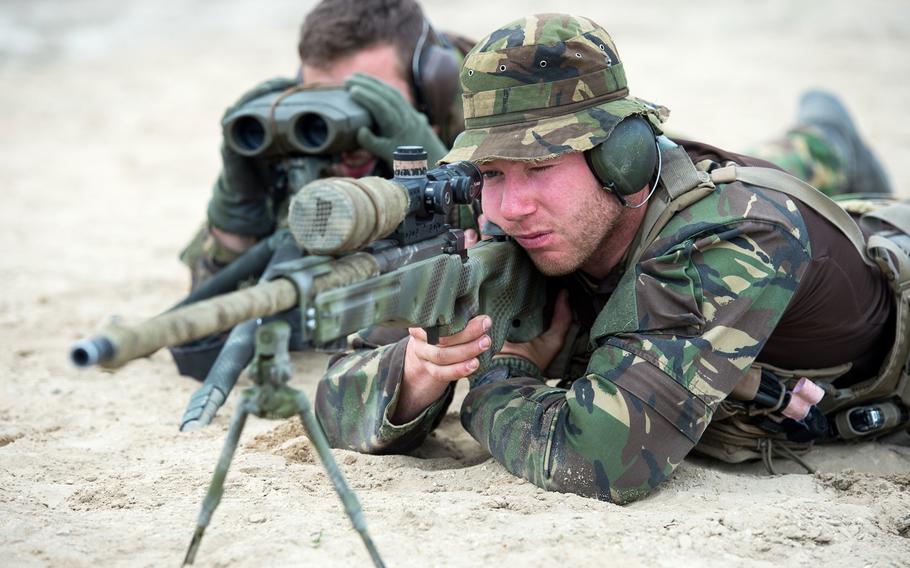 Dutch snipers, Pfc. Paul, right, and Cpl. Bram, from Alpha Company, 11th Infantry Battalion, take aim in a live-fire range in the Zagan Military Training Area in Poland, during NATO Exercise Noble Jump, Monday, June 15, 2015. NATO?s new Very High Readiness Joint Task Force, or spearhead force, was  deployed for the first time with more than 2,100 troops from nine NATO countries.

Josh Keim/U.S. Navy