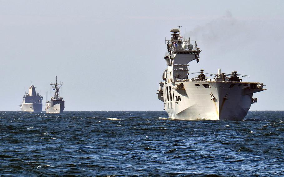 The HMS Ocean, right, Standing NATO Maritime Group 2 Turkish ship TCG Goksu, center, and USS San Antonio, left, steam in the Baltic during a screen exercise as part of Baltic Operations, June 14, 2015. NATO defense ministers meet in Brussels on Wednesday to discuss challenges facing the alliance, including how to shore up commitments to exercises aimed at deterring Russian aggression. 

Amanda S. Kitchner/U.S. Navy